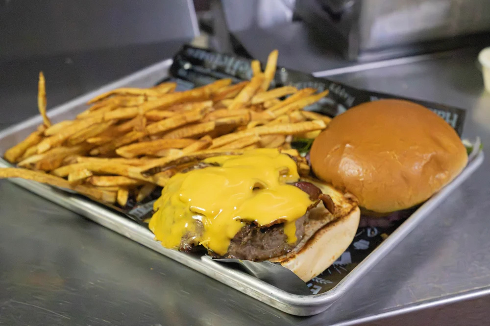 CJ’s cheeseburger with American cheese and fresh-cut fries