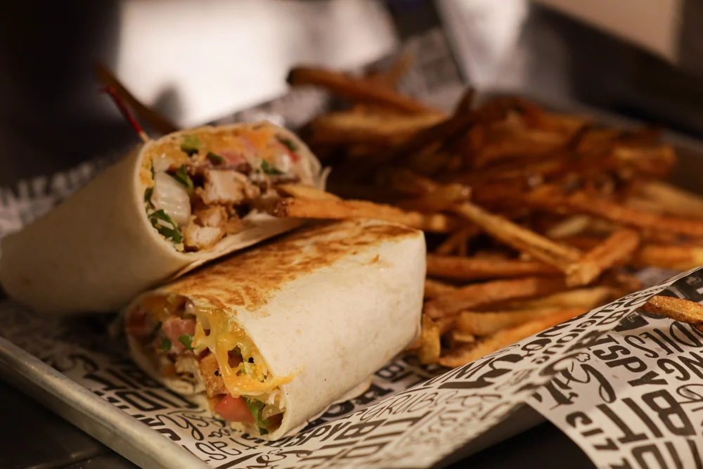 CJ’s grilled wrap with chicken, bacon, cheese and vegetables
