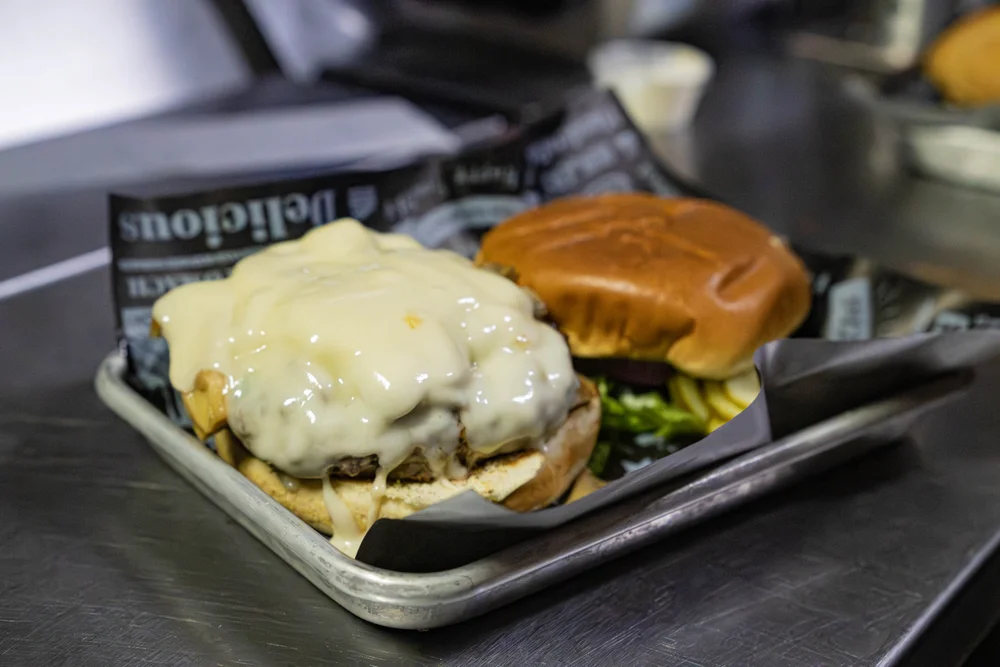 CJ’s mushroom burger with melted Swiss cheese
