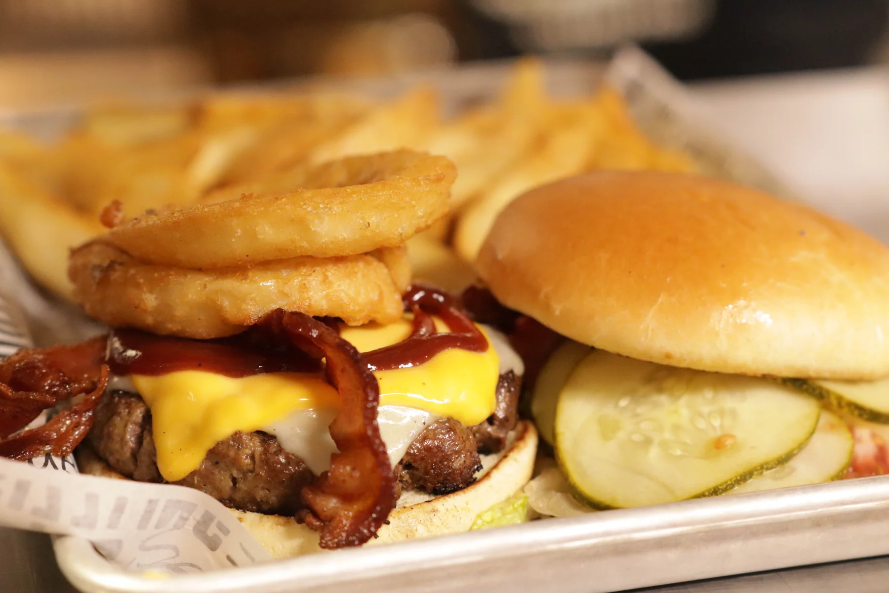 CJ’s actual Rodeo Burger with bacon, cheese, BBQ sauce and onion rings