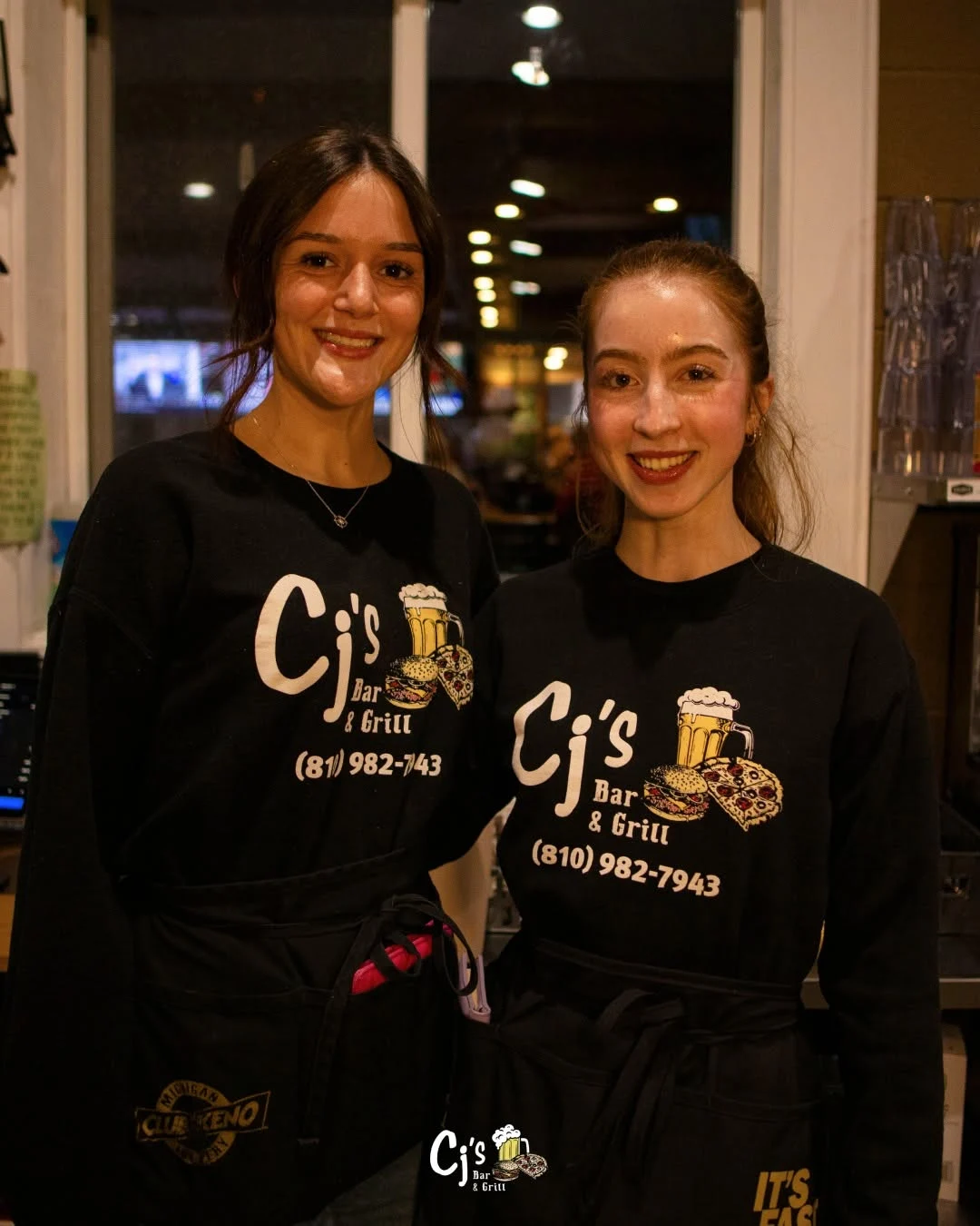 Two smiling CJ’s team members in the restaurant